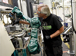 Robot Assists Factory Worker